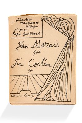 un vieux livre sur lequel figure le dessin d'une tête de femme