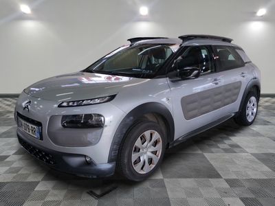 a picture of a silver citrole parked in a garage