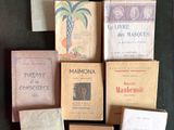many books that are sitting on a table together