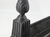 a close up of a metal object on a white surface