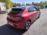 a picture of a red car parked in a parking lot