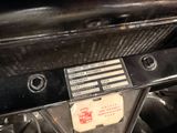 a close up of a car ' s dashboard with a label on it