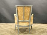 a chair that is sitting on a parquet floor