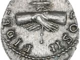 une pièce d'argent sur laquelle figurent une croix et une épée