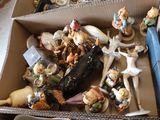 a box full of figurines sitting on a table