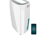 an image of a white air conditioner next to a cell phone