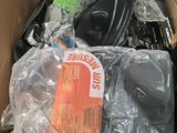 a cardboard box filled with electronic equipment and other items
