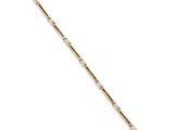 a gold and diamond bracelet on a white background