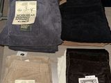a lot of men ' s clothing on display on a table