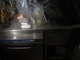 a sink with a lot of trash in it