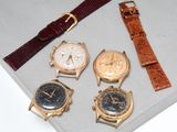 several different types of watches are displayed in a display case