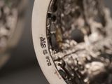 a close up of a silver plate with a design on it