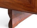 a close up of a wooden table with a picture frame on it