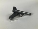 a close up of a toy gun on a white surface