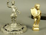 two figurines that are sitting on a table