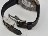 an image of a watch with a tag attached to it ' s strap