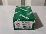 a green box of coffee sitting on a white table
