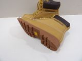 pair of yellow and black boots on a white surface