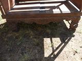 a bed that is sitting on the ground in the grass