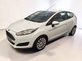 the white ford fiesta is parked in a white room