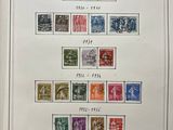 a framed picture of a collection of stamps on a wall