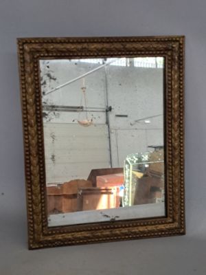 a mirror that is sitting on a table