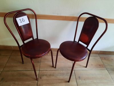 two chairs sitting next to each other on the floor