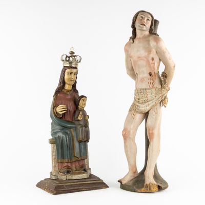 two statues of jesus and a woman with a crown on their heads