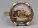 a ring with a picture of a building on it