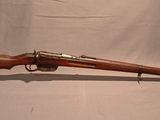 an old rifle with a wooden barrel and a wooden case