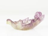 purple and white bowl on a white surface with a white background