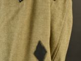 a close up of a military uniform with a patch on the back