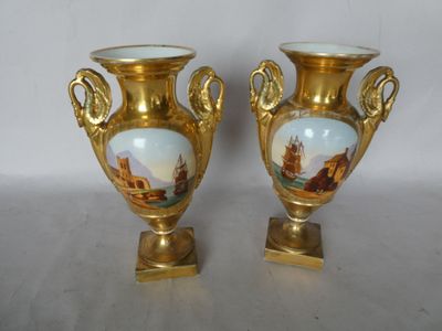 two vases that are sitting on a table