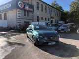 a car parked in front of a building in a parking lot