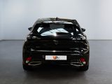 the rear view of a black car in a white room