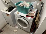 a washer and a dryer in a small room