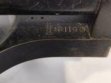 a close up of a gun that is on display