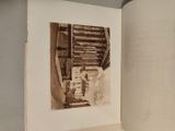 a picture of an old photo in a book on a table