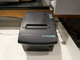 a small printer sitting on a counter in a kitchen