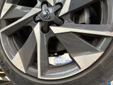 a close up of a car tire with a wheel on it