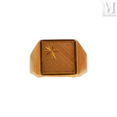 an image of a gold signet ring with a cross on it