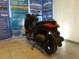 a scooter that is parked in a showroom