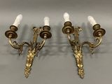 pair of antique brass wall sconces with frosted glass shades