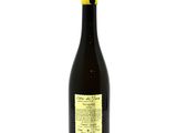 a bottle of wine sitting on top of a white table
