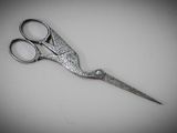 a close up of a pair of scissors on a table