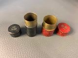 three different types of bullet shells sitting on a table