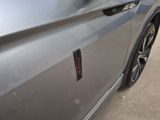 a close up of a car door with a sticker on it