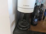 a coffee maker that is sitting on top of a counter