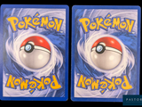 two cards with pokemon on them on a black background