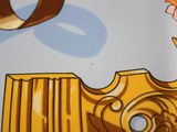 a picture of a close up of a fabric with a clock on it